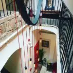 48 hours in Budapest. Image of the hallway at the Pest Buda Hotel. The modern style details contrast against the historic nature of the building
