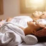 The rise of the leisure centre day spa (Verulamium Spa, St Albans) Image of man and woman having scalp messages on treatment beds