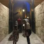 Happy Travels: Where you absolutely should go in Malta. Image of people entering Mdina at night