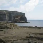 Happy Travels: Where you absolutely should go in Malta. Image of rocks and sea at Azure Window