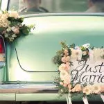 4 Tips to reduce wedding planning stress. Image of Beautiful wedding car with plate JUST MARRIED