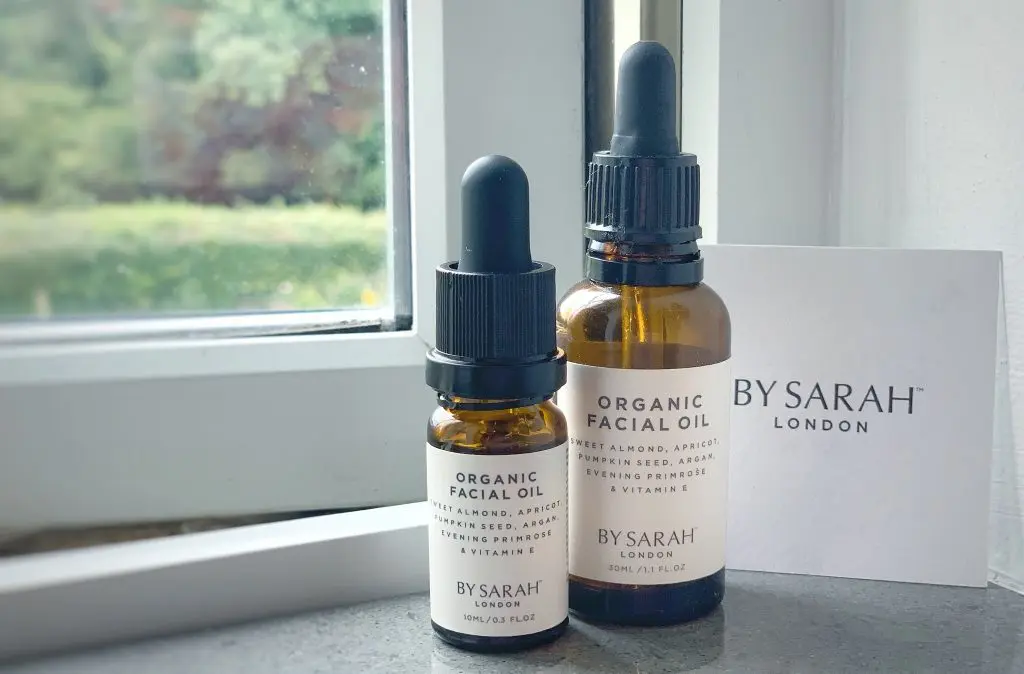 By Sarah London Organic Facial Oil Review - Image of 30ml & 10ml By Sarah London Facial oils on a windowsill