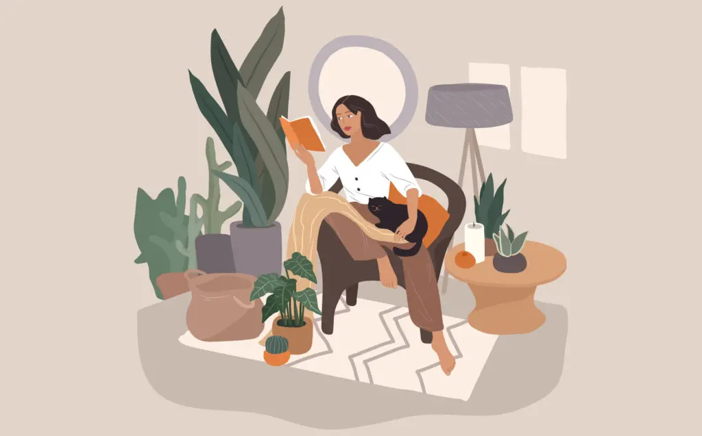 Woman sitting enjoying a book to improve her well-being