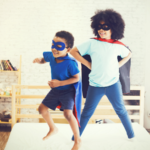 Happy & confident kids dressed as superheroes