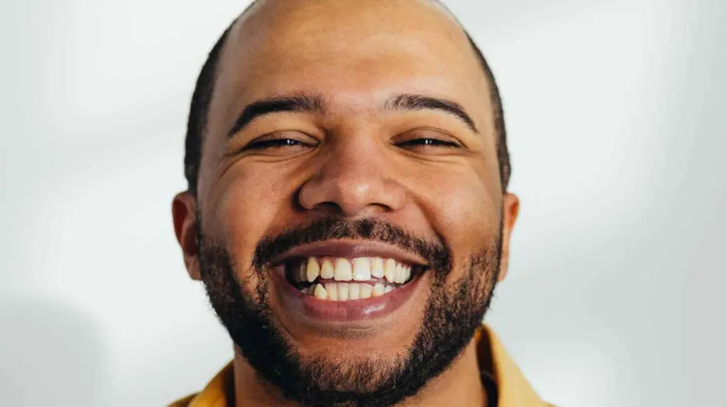 smiling, happy man to symbolise a reduction in anxiety