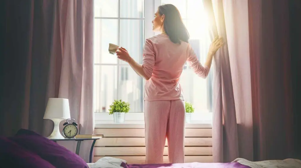 Woman at her window in the morning