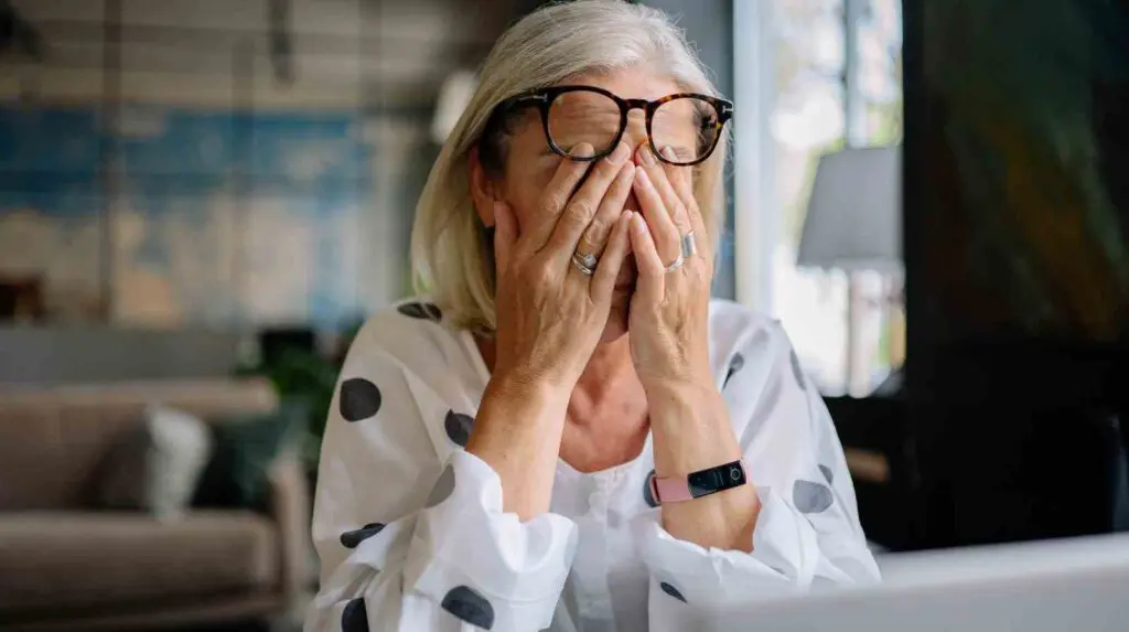 Woman overwhelmed by reading negative news stories