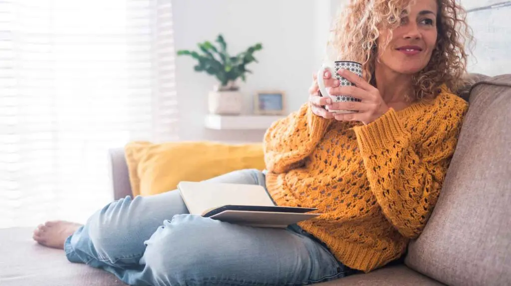 Woman relaxing at home with no guilt