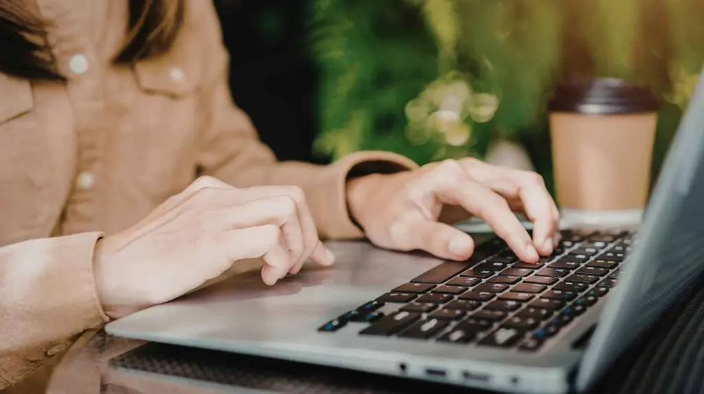 Woman sitting working at her laptop
