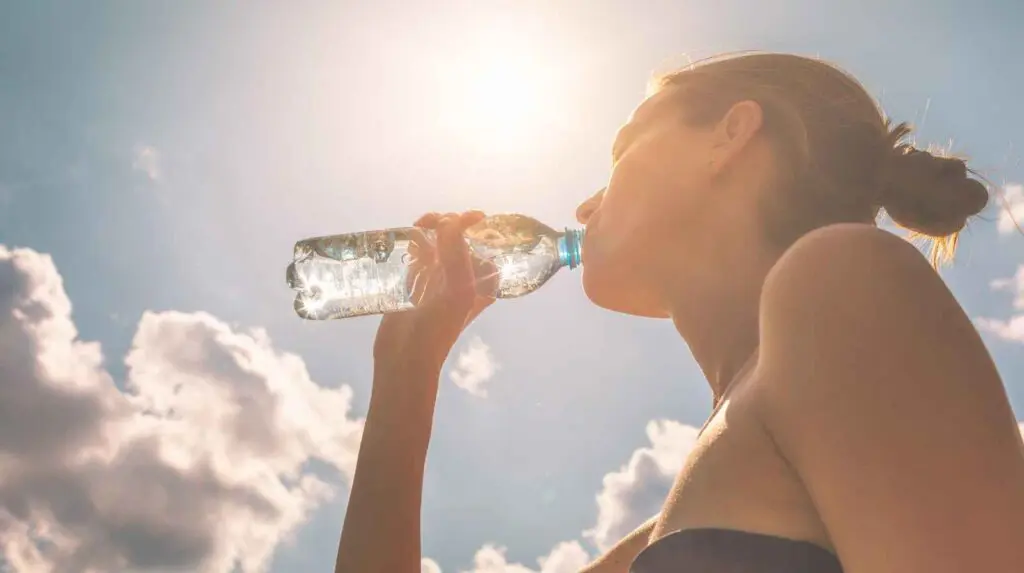woman staying hydrated in hot weather