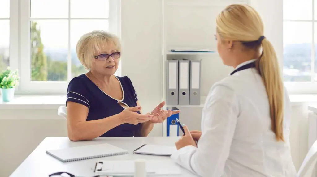 Woman asking questions to a healthcare provide before starting HRT
