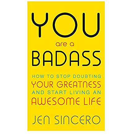 5 great books to help you lead a more positive lifestyle. Front cover image of You are a Badass: How to stop doubting your greatness and start living an awesome life by Jen Sincero