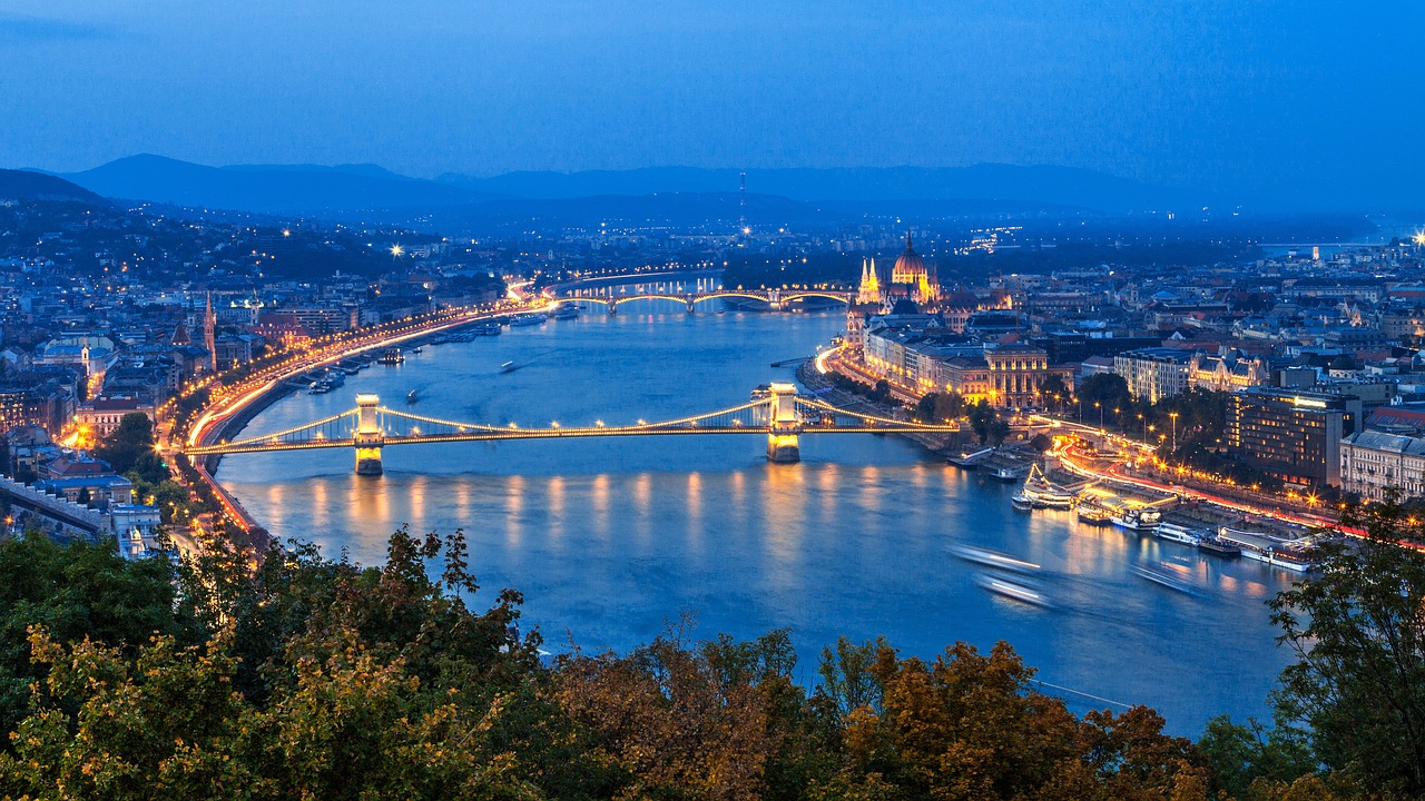 48 hours in Budapest: Image of The Szechenyi Chain Bridge lit up at night.