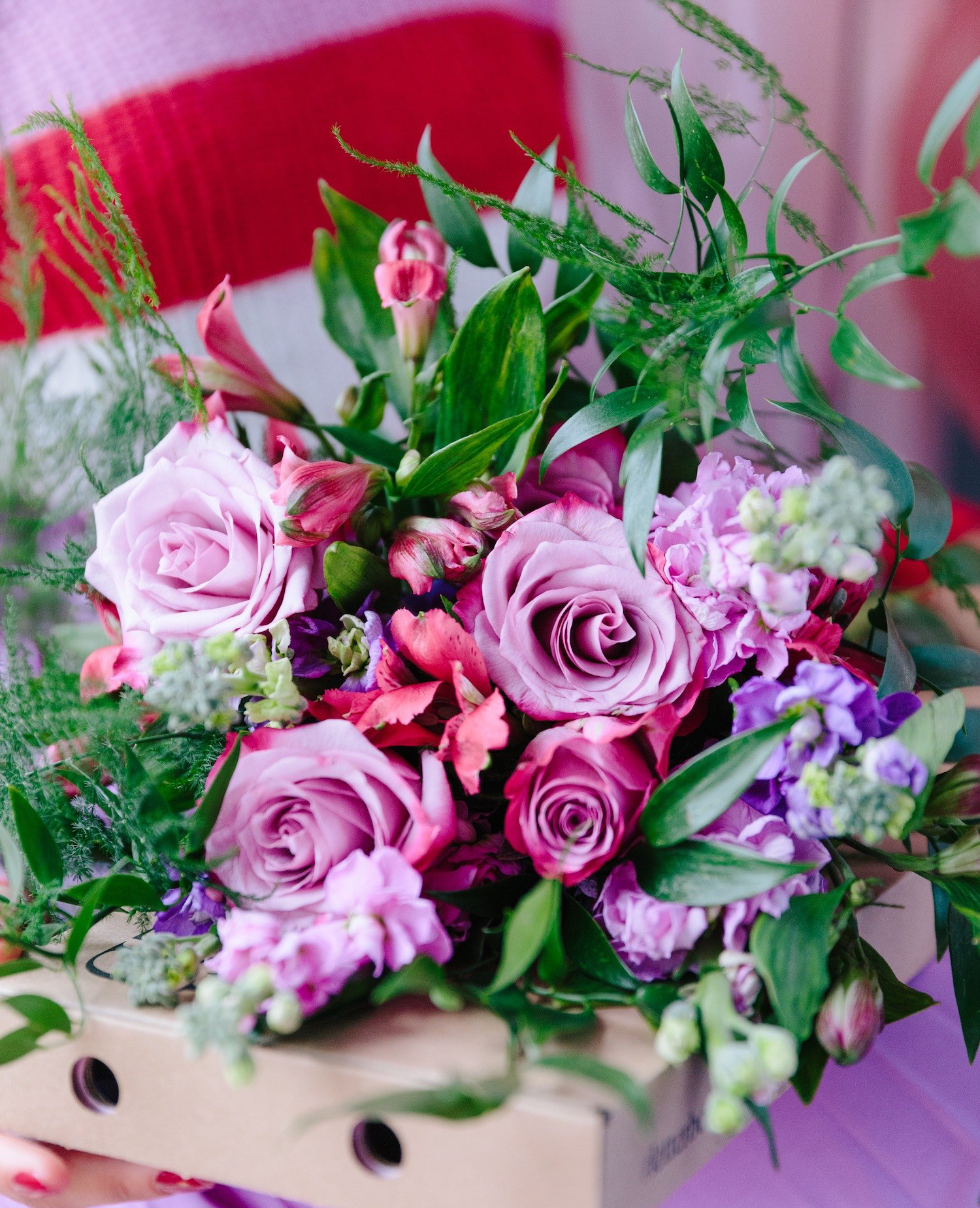 Blooming lovely: the positive power of flowers. Image of purple, pink and green flower bouquet