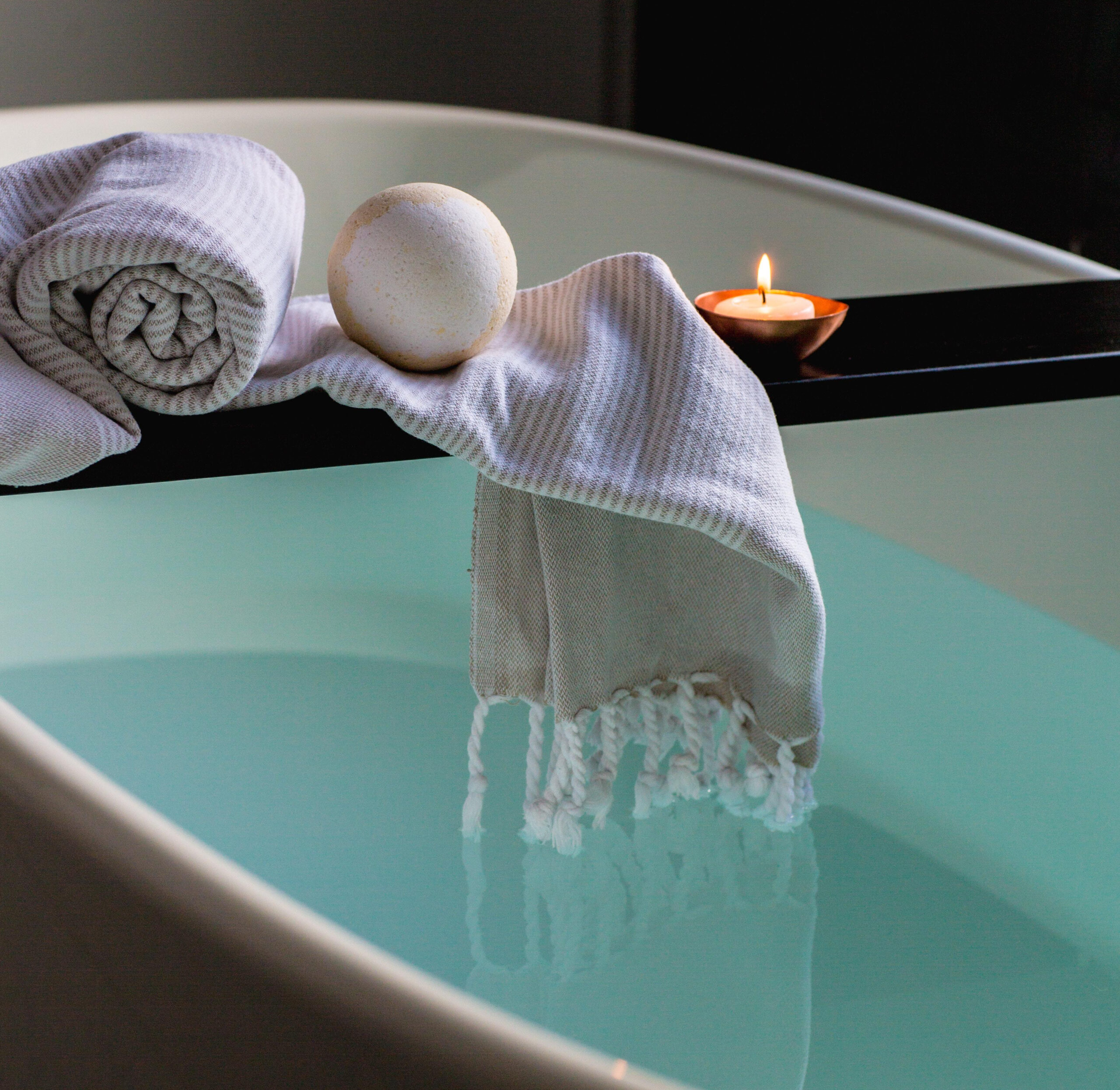 Sleep well: How to win at sleeping! (and why you should want to) How to get a good night's sleep. Image of a relaxing bath with a towel and lit candle