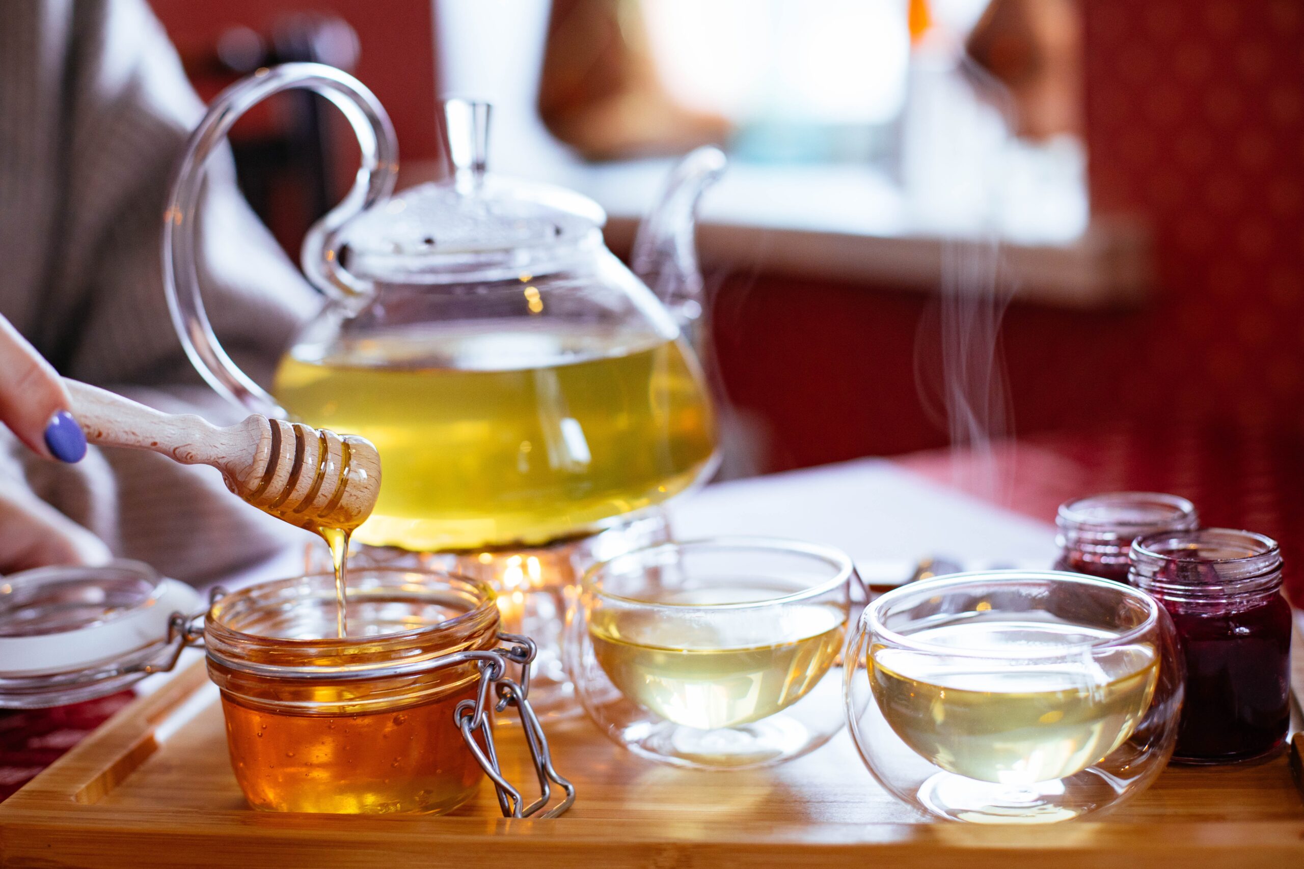 Sleep well: How to win at sleeping! (and why you should want to) How to get a better night's sleep Image of tea cups with honey being drizzled