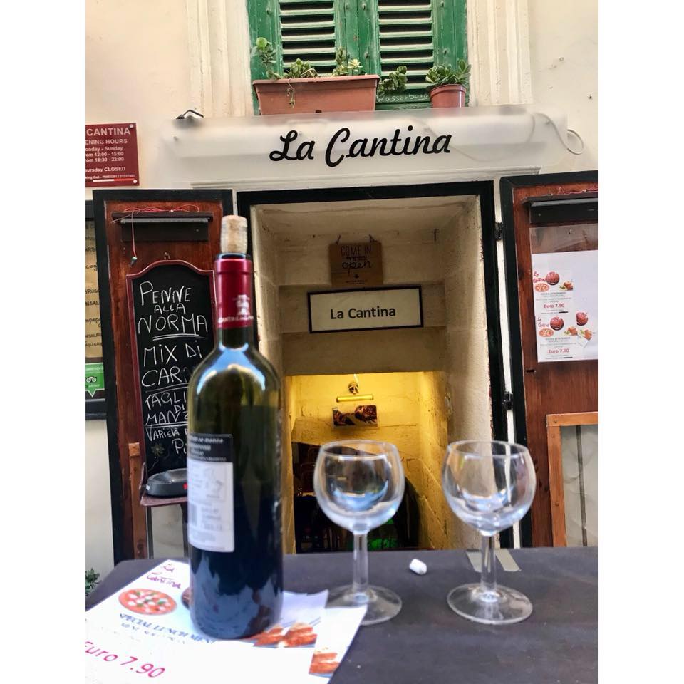 Happy Travels: Where you absolutely should go in Malta. Image of entrance to La Cantina restaurant Valletta
