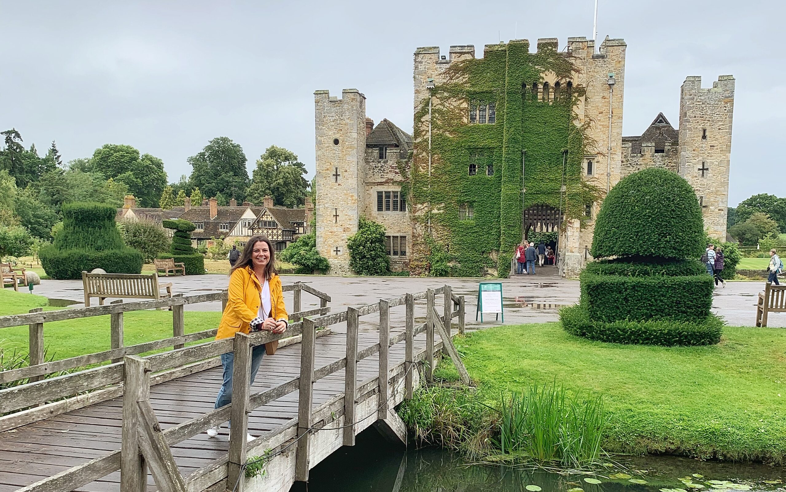Alex Grace standing on a footbridge with Hever Castle in the background